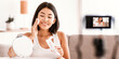 © Prostock-studio - Applying Toner. Asian Woman Cleaning Face With White Pad Looking In Mirror. Beautiful Lady Removing Makeup With White Cosmetic Cotton Pad, Recording Vlog On Camera For Social Media Channel
