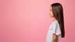 © Prostock-studio - Pure beauty of young. Little child with long hair isolated on pink background, profile