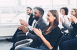 © Prostock-studio - Group of business people applauding speaker after presentation in conference room