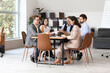© Pixel-Shot - Group of lawyers working at table in office