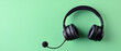 © artzone - Black Headphones On A Green Background