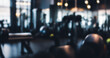 © al-sultan - Blurred interior of a gym with exercise equipment fitness training and weights.