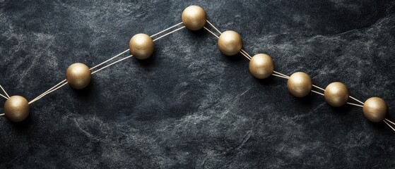 Fototapete - Golden Spheres Connected by Lines on Dark Textured Background Overhead Shot for Network Concept