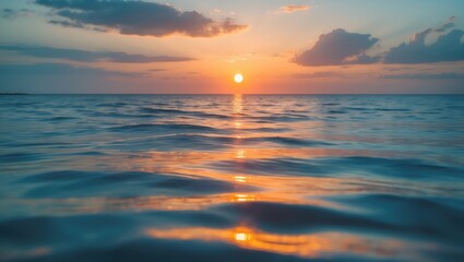 Wall Mural - sunset over the ocean with vibrant orange sky background