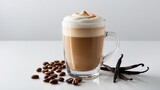 White background featuring a vanilla latte in a glass with vanilla beans and coffee beans