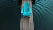 © Rizvan - Adirondack chair in blue on a dock