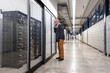 © Westend61 - Manager inspecting server room in a production hall