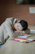 © mojo_cp - Tired asian business woman overworking and Sleep at work