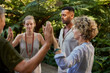 © Rido - People in circle passing energy and praying together