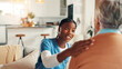 © peopleimages.com - Happy, support and nurse with old woman on sofa for Healthcare advice, kindness and trust. Medical caregiver, retirement and consulting with senior patient in nursing home for help and elderly care