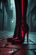 © Rafal Woo - Black leather boots with red reflections in dark urban alley at night