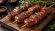 © Dilruba - Top view of gourmet meat skewers on wooden tray arranged for authentic restaurant menu style