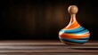 © Freshpixel - This captivating image showcases a colorful spinning top, suspended in mid-air, with bold swirling patterns that invite viewers into a world of playful creativity and nostalgia.