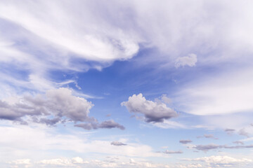 Wall Mural - Beautiful soft gentle cloudy blue sky with white light cirrus clouds, abstract background texture