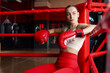 © New Africa - Woman sitting in her corner of boxing ring. Space for text