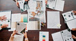 © peopleimages.com - Planning, creative and above of business people in meeting for project ideas, research and discussion. Design agency, office and workers with paperwork for teamwork, collaboration and brand strategy