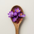 © ULFAITA - Saffron spice in a wooden spoon