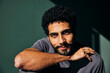 © Maskot - Portrait of sunlight shining on smiling bearded man