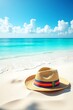 © Tanjina - Straw hat with rainbow ribbon on a beautiful tropical beach with turquoise water.