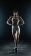 © vadim_fl - Young beautiful woman with athletic body on dark background. Fitness girl