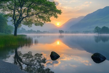 Poster - Serene lake landscape at dawn with mist and mountains reflected on calm water under gentle morning light