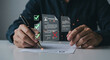 © Babar - Person signing a document with floating approved and rejected icons and check marks on a white surface real estate business ,technology ,selling ,purchasing ,agreement ,$