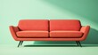 © Ceyhun - A bold fabric sofa in coral pink, featuring sleek black legs, set against a light green background with shadow
