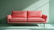 © Ceyhun - A stylish fabric sofa in muted pink, featuring subtle black legs, set against a pale green background with shadow