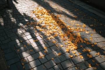 Poster - Golden Leaves Scattered on a Tiled Street Creating a Beautiful Autumn Scene Under Soft Shadows Generative AI