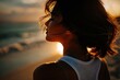 © Srga Artworks - Silhouette of woman with short brown hair in white tank top backlit by sunset at beach