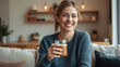 © Luna - A woman sits on a couch holding a glass of beer, perfect for advertising or social media