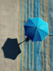 Aufkleber - Bright Beach Umbrella Casting a Shadow on a Striped Towel During a Sunny Day at the Shore Generative AI