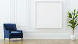 © Somporn Na Ubon - Modern interior featuring blue armchair, blank white frame on wall, and green potted plant, creating serene atmosphere