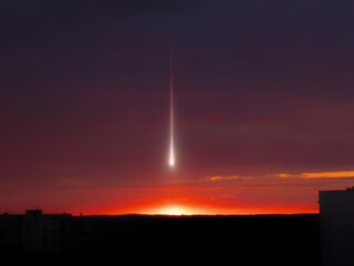 Wall Mural - meteorite in the evening sky after sunset. bolide above the horizon. beautiful shooting star isolate