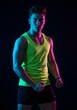© Josh Zachary - Athletic male in fitness gear, neon lighting studio shot