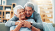 © FrameFlex/peopleimages.com - Portrait, hug and old couple with love, home and bonding together with smile in living room. Face, apartment and senior man with elderly woman, embrace and retirement with relationship and marriage