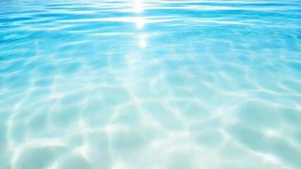 Poster - Sunlight reflecting off the surface of clear turquoise water creates mesmerizing patterns of light and shadow dancing across the sandy bottom, enhancing the tranquil tropical scene