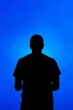 © Bayara - Man Silhouette with Blue Background.