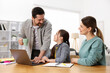 © New Africa - Parents helping their daughter with homework at wooden table indoors