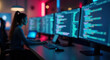 © Eduardo Accorinti - Blurred out of focus scene with female programmer working on source code using multiple computer monitors in a dark office at night, developing new software with colorful ambient lights