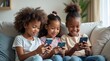 © Nathan - Three young girls enjoying their smartphones on a cozy couch, showcasing joy and friendship.