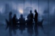 © Zahra - Silhouetted businesspeople in a meeting, city view.