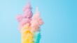 © MAY - Colorful smoke rising from a fountain, creating a unique contrast against a bright blue sky.