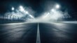 © Mood - Empty race track at night, shrouded in fog.  Powerful spotlights illuminate the asphalt course
