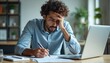 © Maryna - Frustrated Indian businessman works at office desk solving issues. Arabian businessman troubles with paperwork, documents, loss finances, budget problems. Stressed, disappointed, negative emotions.