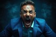 © kik - Angry man with beard screams intensely showing strong emotion wearing blue suit against dark smoky background
