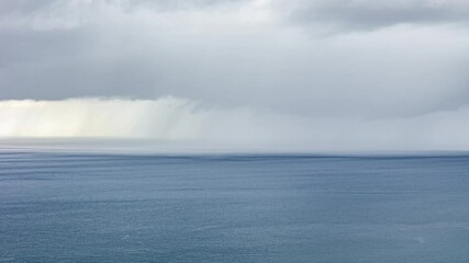 Wall Mural - stormy clouds above seascape of senggigi beach, west nusa tenggara, indonesia. timelapse