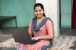 © Pix4Ads - Indian happy Rural Teenage Girl Student during online class on laptop. Portrait of Happy young indian school girl using laptop. Concept of skill india concept.