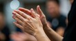© milyar - Close-up of Applause: Hands Clapping in a Blurred Background