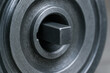 © newlifestock - Metal machinery part with belts and circular grooves designed for industrial use in mechanical systems and equipment